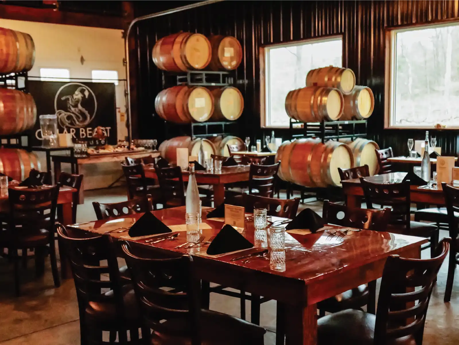 The Cellar Beast Barrel Room set with tables for a private event