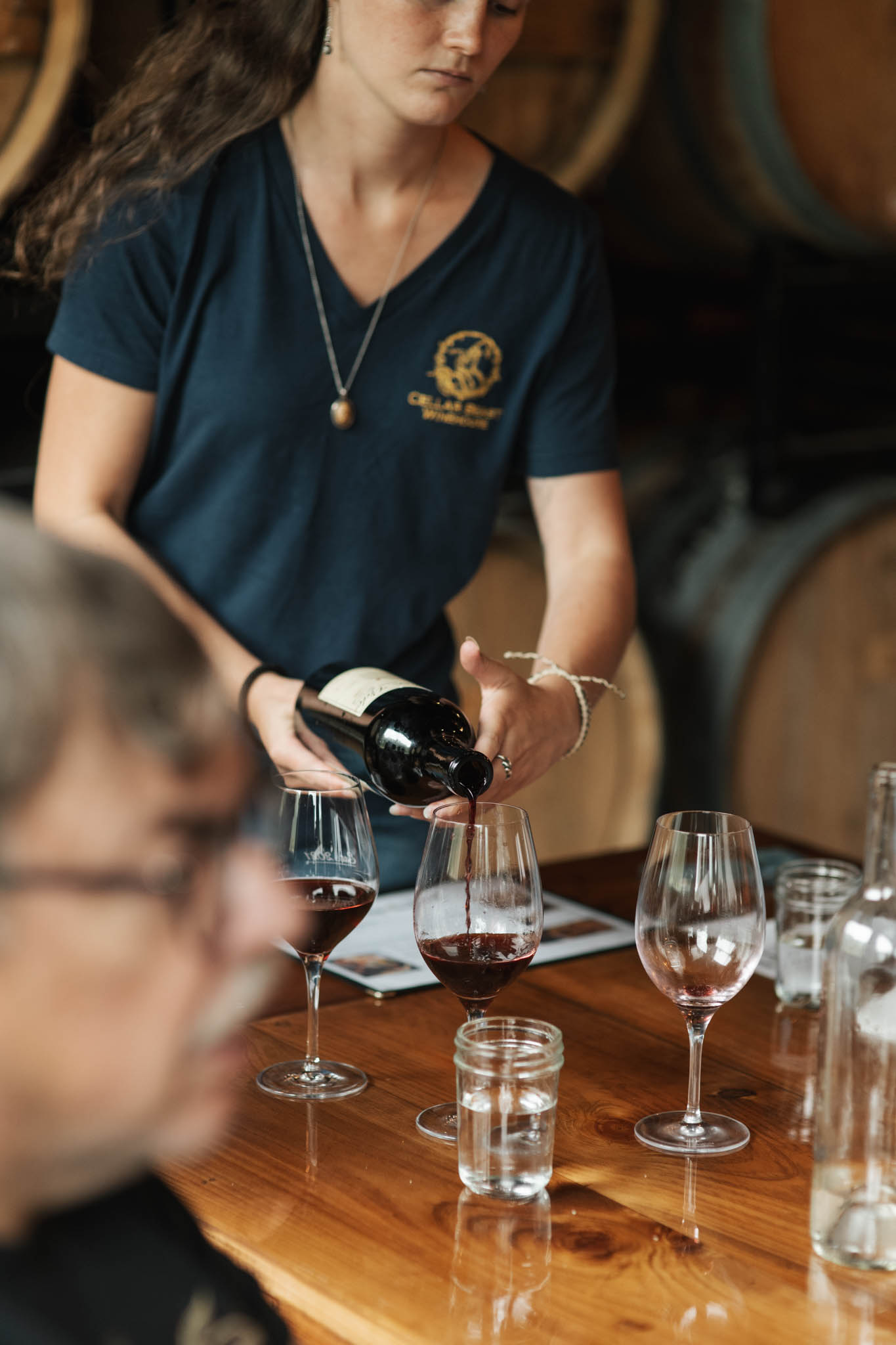 Pouring a flight of red wine during a guided tasting at Cellar Beast