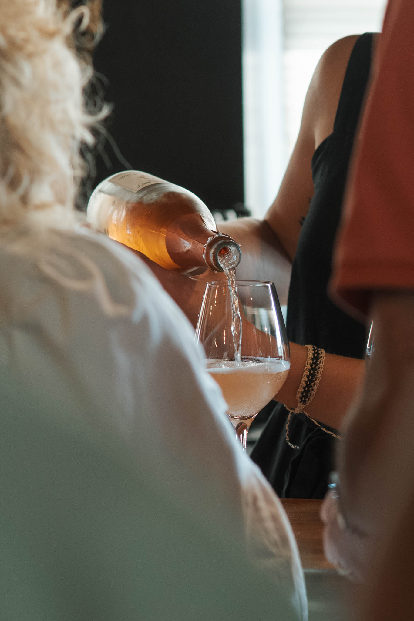 Pouring Cellar Beast rosé during a guided tasting