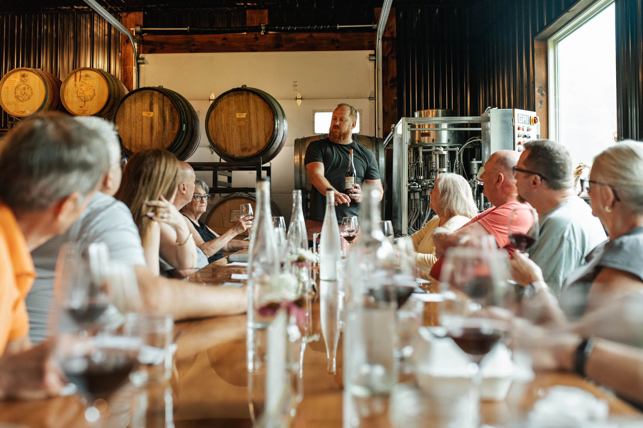 Cellar Beast winemaker leading a guided tasting in the barrel room